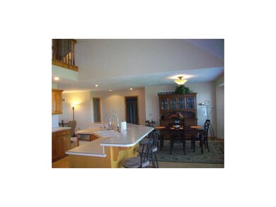 View of dining room between kitchen and living roo