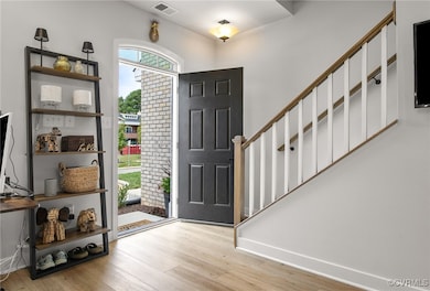 Ground level entry featuring light LVP flooring, L