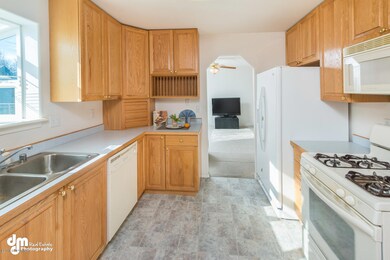 Kitchen with high oak cabinets