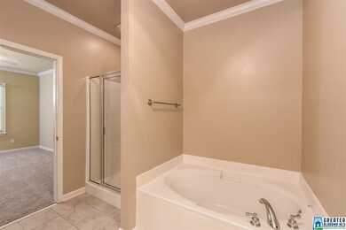 The master bath has separate garden tub and shower