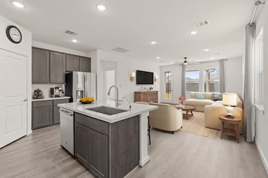 Step into this beautifully designed open-concept home! The open flow connects the kitchen and living area, making it ideal for those who appreciate refined, modern living with a timeless touch. *This photo has been virtually staged