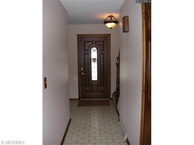 Foyer accented with subway tiled floor, new leaded