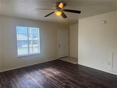 Empty room with wood finished floors and a ceiling