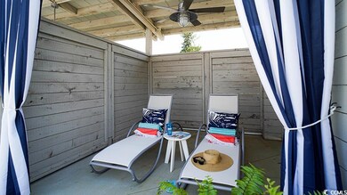 View of patio with ceiling fan
