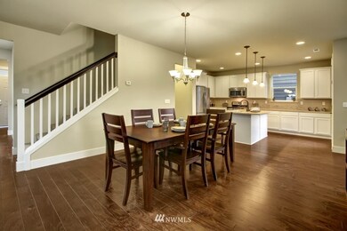 Open kitchen and dining.  Perfect spacing for breakfast for 2 or a large dinner party.