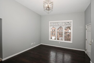 Living room overlooks Fulton Ave.  Wood floors, hi