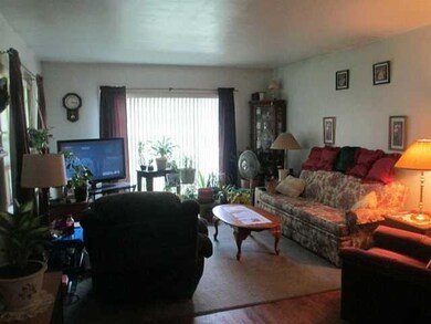 Living Room Bright living room with hardwood floor
