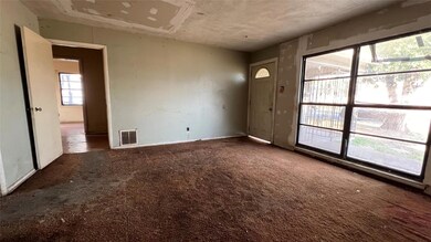 Unfurnished room featuring carpet