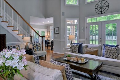 The great room opens to the breakfast nook, kitche