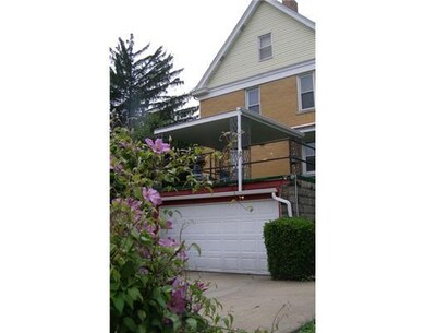 Exterior Back. Covered patio offers protection fro