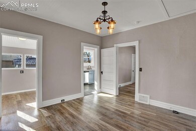 From formal dining room leading to sunny kitchen n