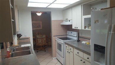 Galley kitchen with lots of overhead light and pas
