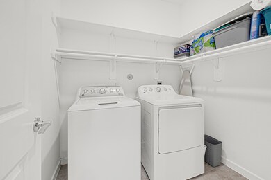 This bright and functional laundry room features a