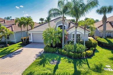 Mediterranean / spanish house featuring a tile roo
