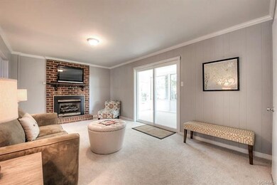 Family room with gas fireplace, half bath access, 