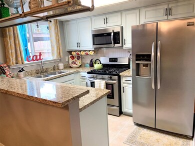 Kitchen with granite counter tops and stainless st