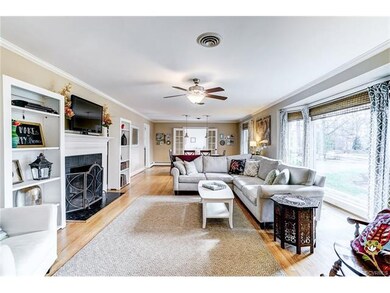 Bright Living Room with wood burning fireplace, bu