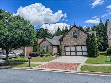 View of front of house featuring concrete driveway