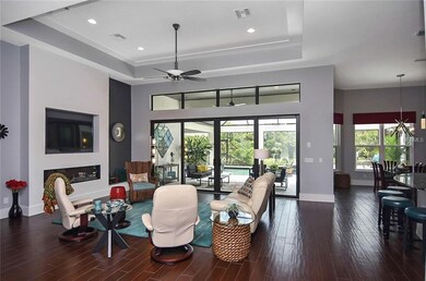 Living room with sliders to lanai and pool