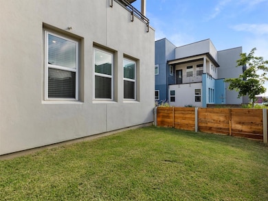 View of yard with a balcony