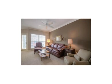 Great room boasts high ceilings, crown molding and
