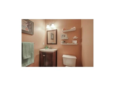 RE-MODELED HALF BATH OFF ENTRY HALL.