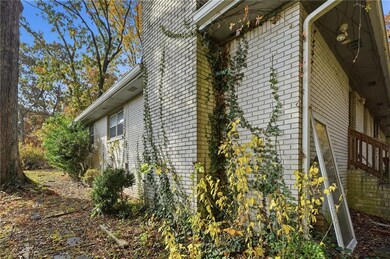 View of property exterior featuring brick siding