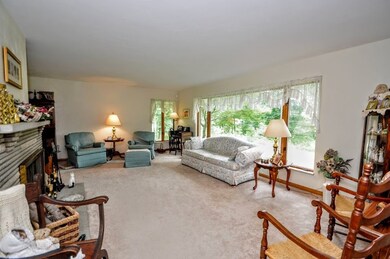 Spacious LR with large picture window and stone co
