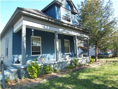 Great covered porch with nice landscaped bed
