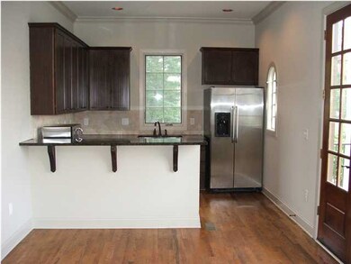 Kitchen with breakfast bar and dining room with Fr