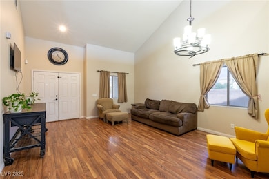 Living area high vaulted ceiling, wood finished fl