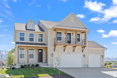 View of front of house featuring a mountain view, a shingled roof, driveway, and covered porch
