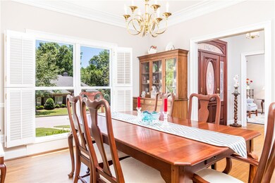 Dining room with crown molding & plantation shutte