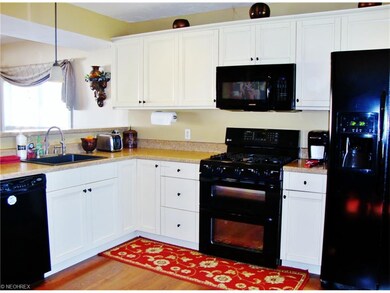 Spacious kitchen with beautiful white cabinetry.