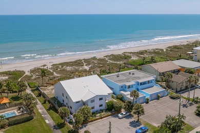 Unit on left in White Building