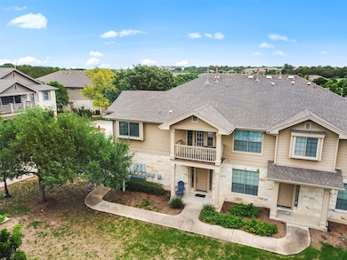 Multi unit property featuring roof with shingles,