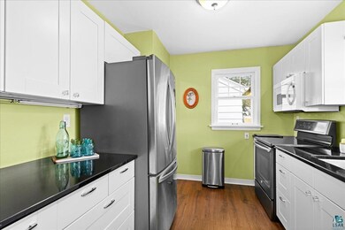 Kitchen with baseboards, stainless steel appliance