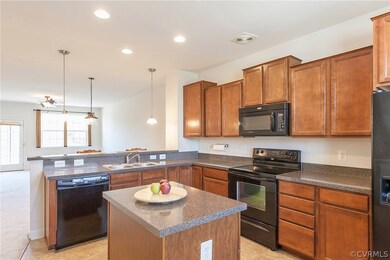 Kitchen looking into open dining/living room.