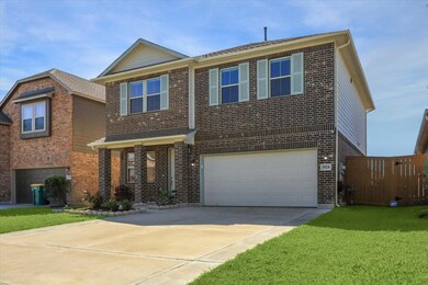 Brick home with extra wide driveway.