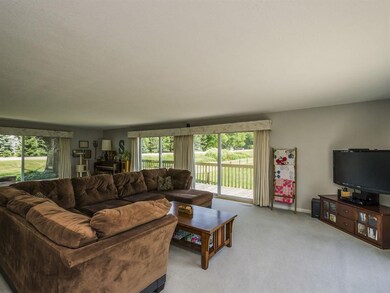Large living room with access to wrap around deck