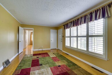 ENTERTAINING LIVING ROOM WITH LARGE PICTURE WINDOW THAT GIVES PLENTY OF NATURAL LIGHT