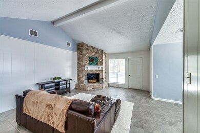 Vaulted ceilings make this room feel even larger t