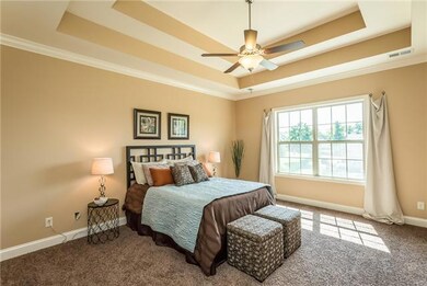 Master Bedroom has double trey ceiling & crown moulding.