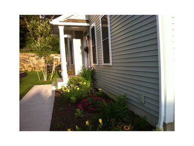 Exterior Front. Spring and summer perennials aboun