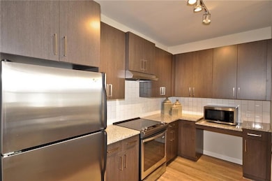 Kitchen featuring appliances with stainless steel 