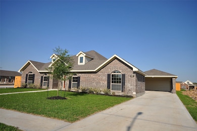 Long drive to a 20x30 detached garage with an additional 2 covered spaces under the Porte Cochere.