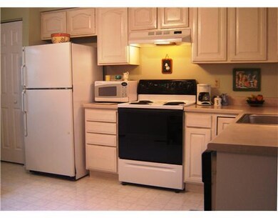 Kitchen. A Whirlpool electric range, dishwasher an