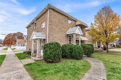 View of side of property with a yard