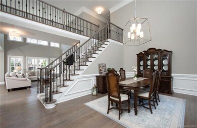 Formal dining room with wainscoting and hardwood f