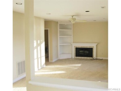 View of Family Room with Built-in Corner Cabinet